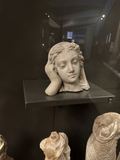 "Weeping Lady" — a marble head, weary or mourning in expression, resting on one hand
